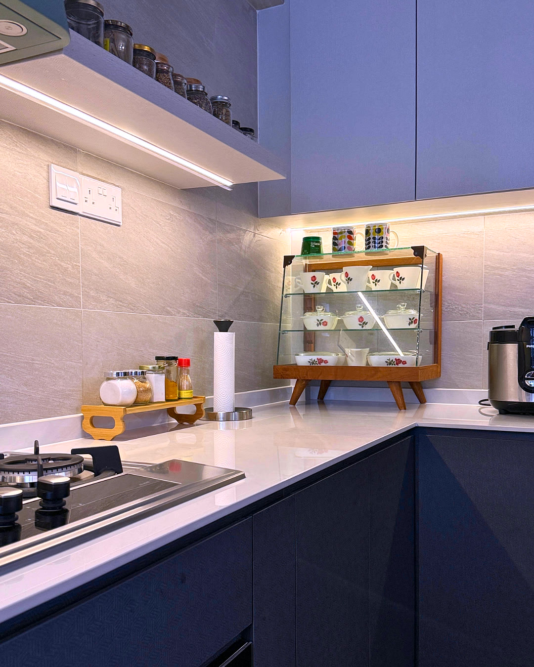 Kitchen counter with open display shelving.