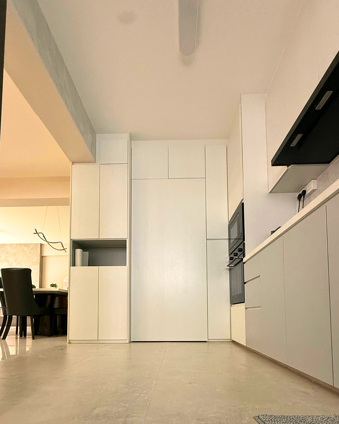 White kitchen and wardrobe corridor.