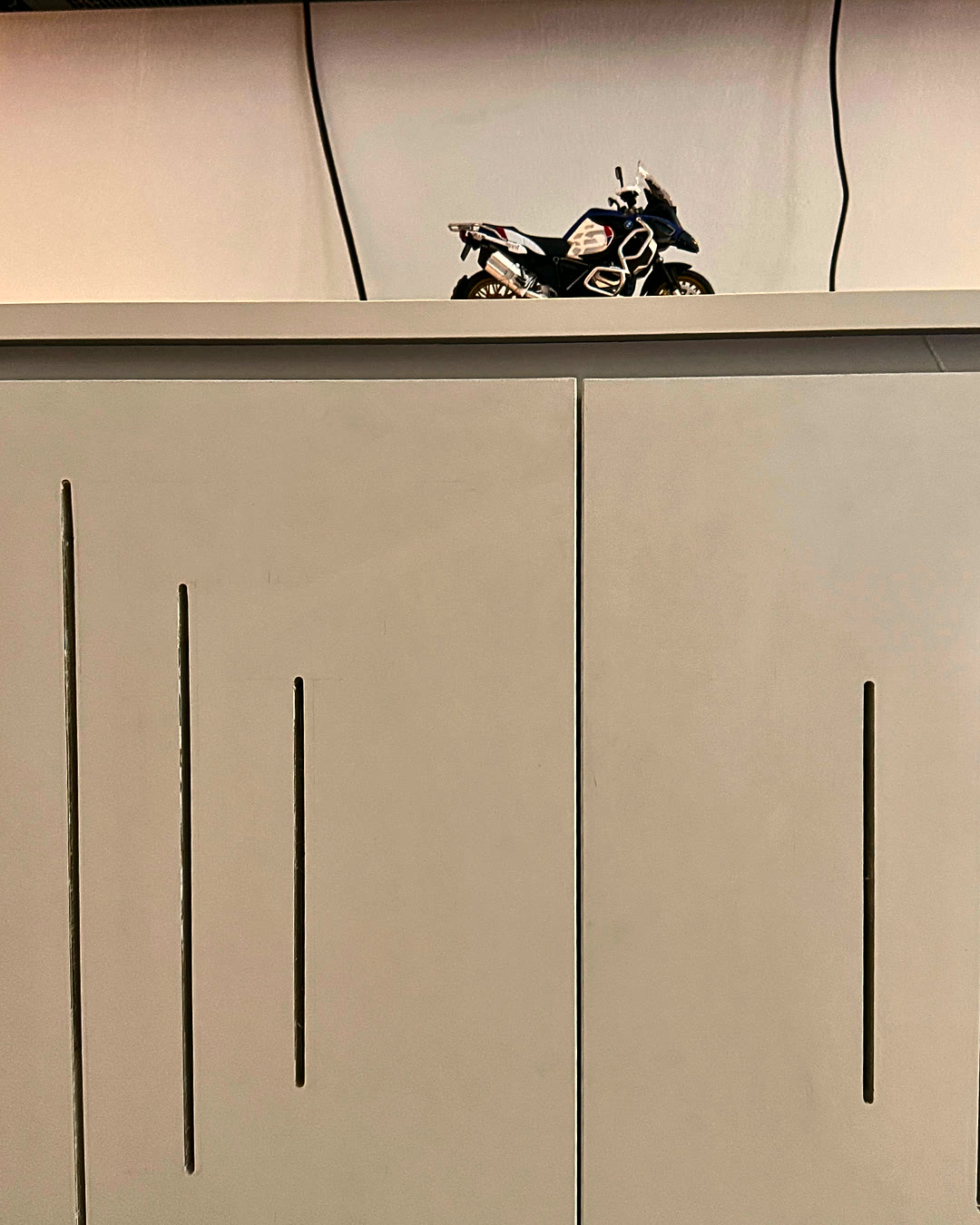 Low storage cabinet with decorative display top.